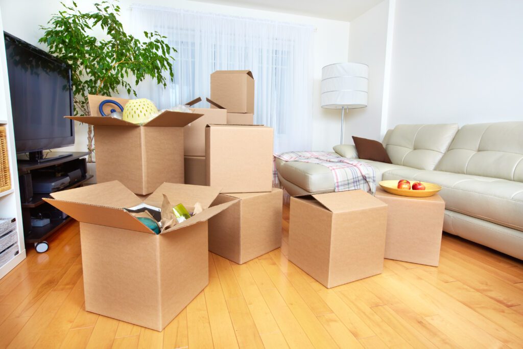 Open boxes kept in a house from shifting to a new house in dubai, uae by a Apartment movers in Dubai